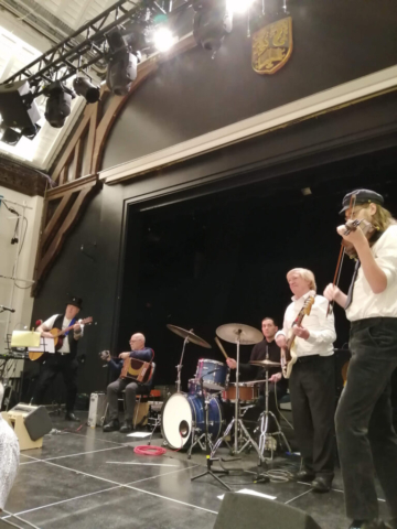 the ceilidh band on stage at the university of Birmingham