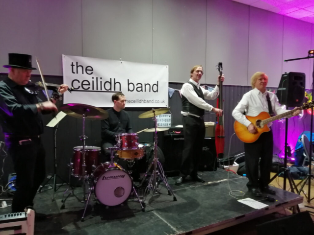 the ceilidh band on stage